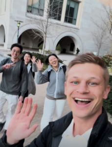 P. Goeckner waving in front of JD students and WCC building.